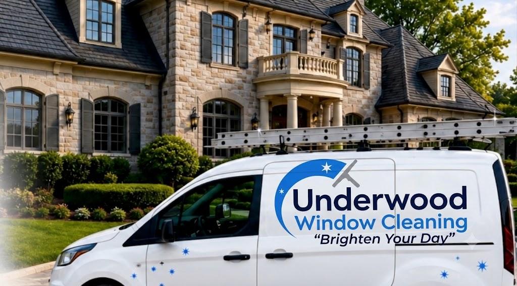 Underwood Window Cleaning van in the driveway of a large Knoxville home with freshly cleaned windows