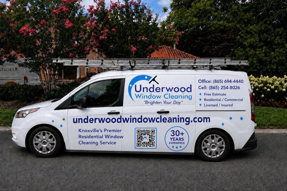 The fully branded Underwood Window Cleaning van, ladders on the roof rack, parked in a Knoxville driveway